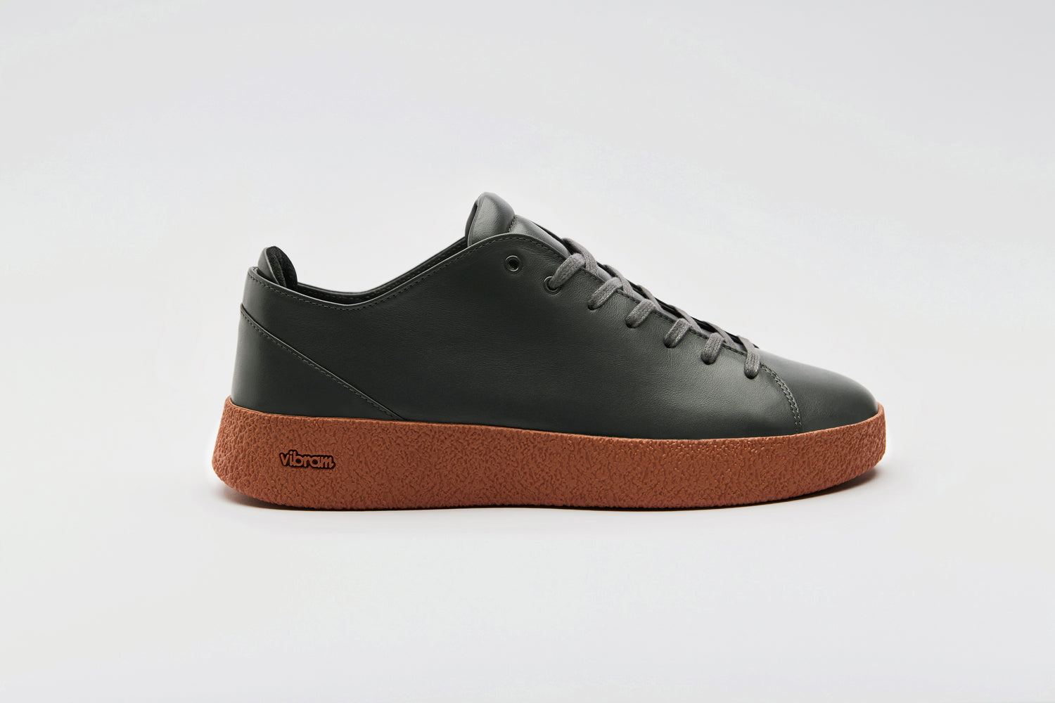 Premium dark grey leather on top a sienna Vibram crepe sole.