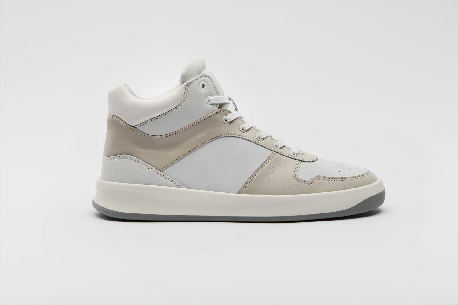 Premium white and off-white sneaker with a calfskin leather lining.