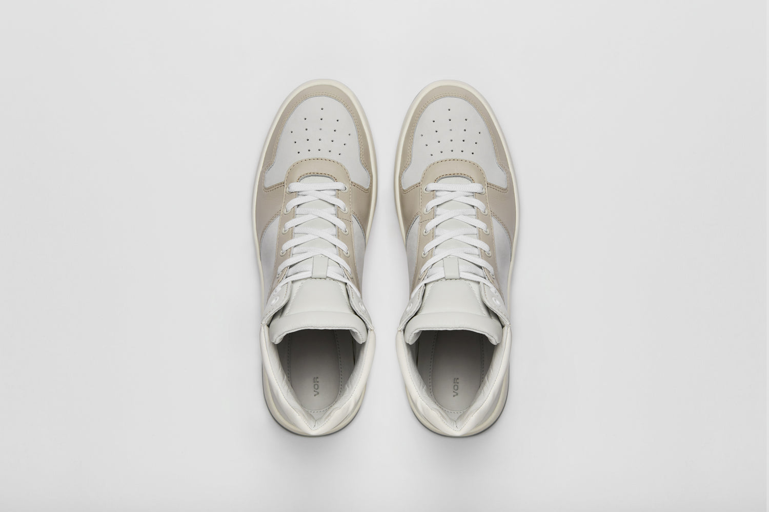 High-top sneaker consisting of different white leather panels.