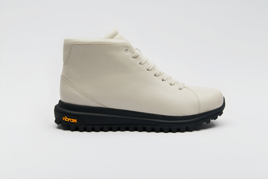 An elegant shade of beige sitting atop a rugged Vibram hiking sole.