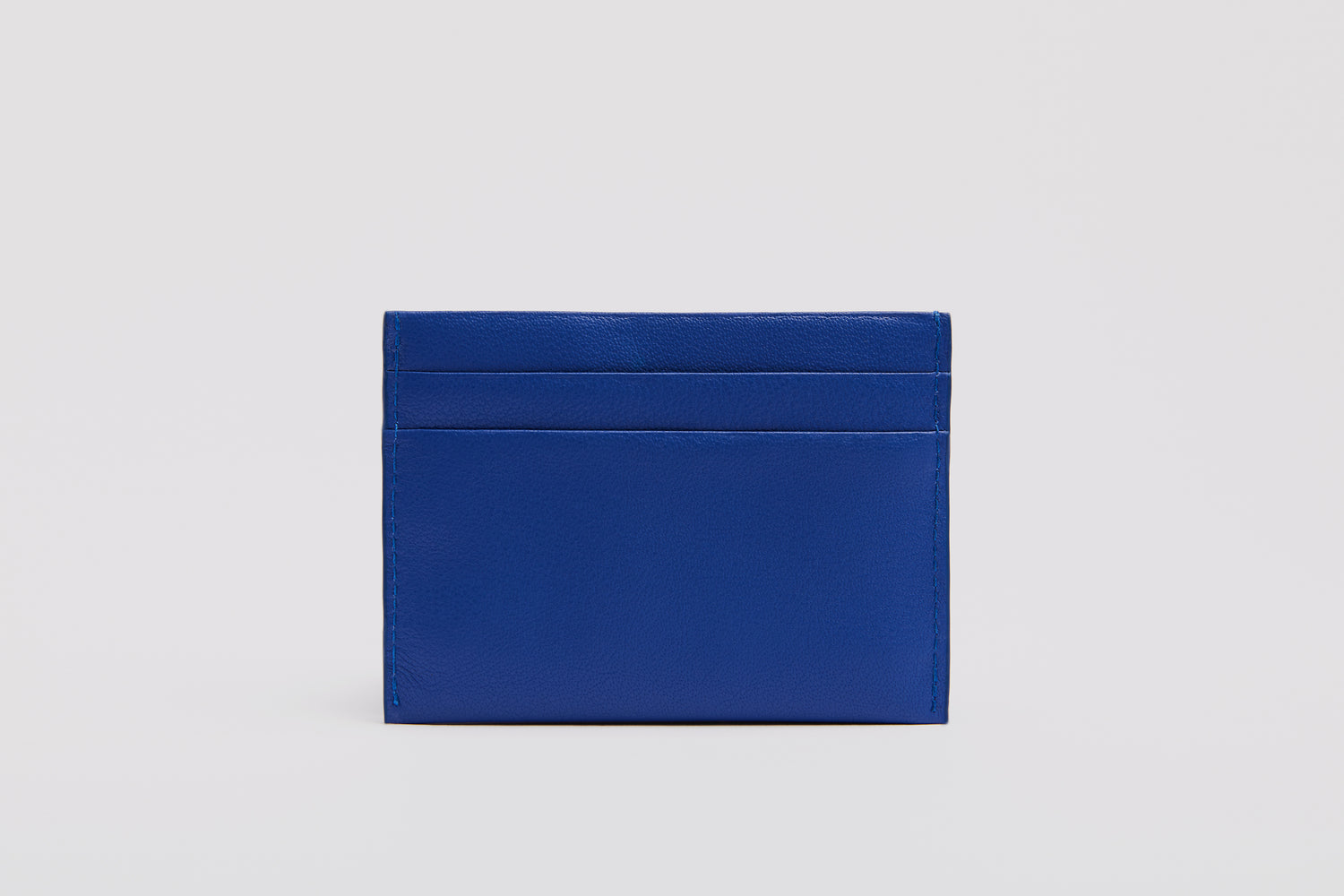 Vibrant blue cardholder made from premium full grain leather.