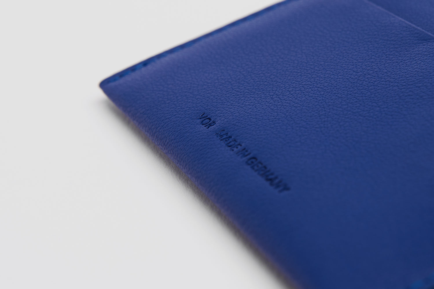 Premium blue cardholder, made in Germany.