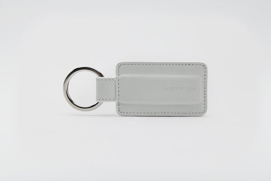 Premium off-white leather keyring.