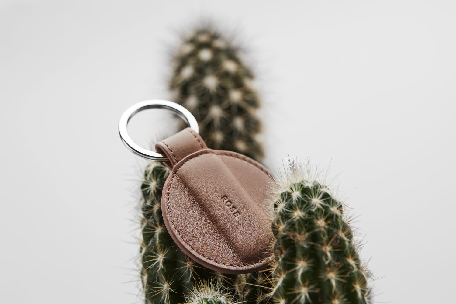 A dusky pink keyring made from premium leather. Made in Germany.