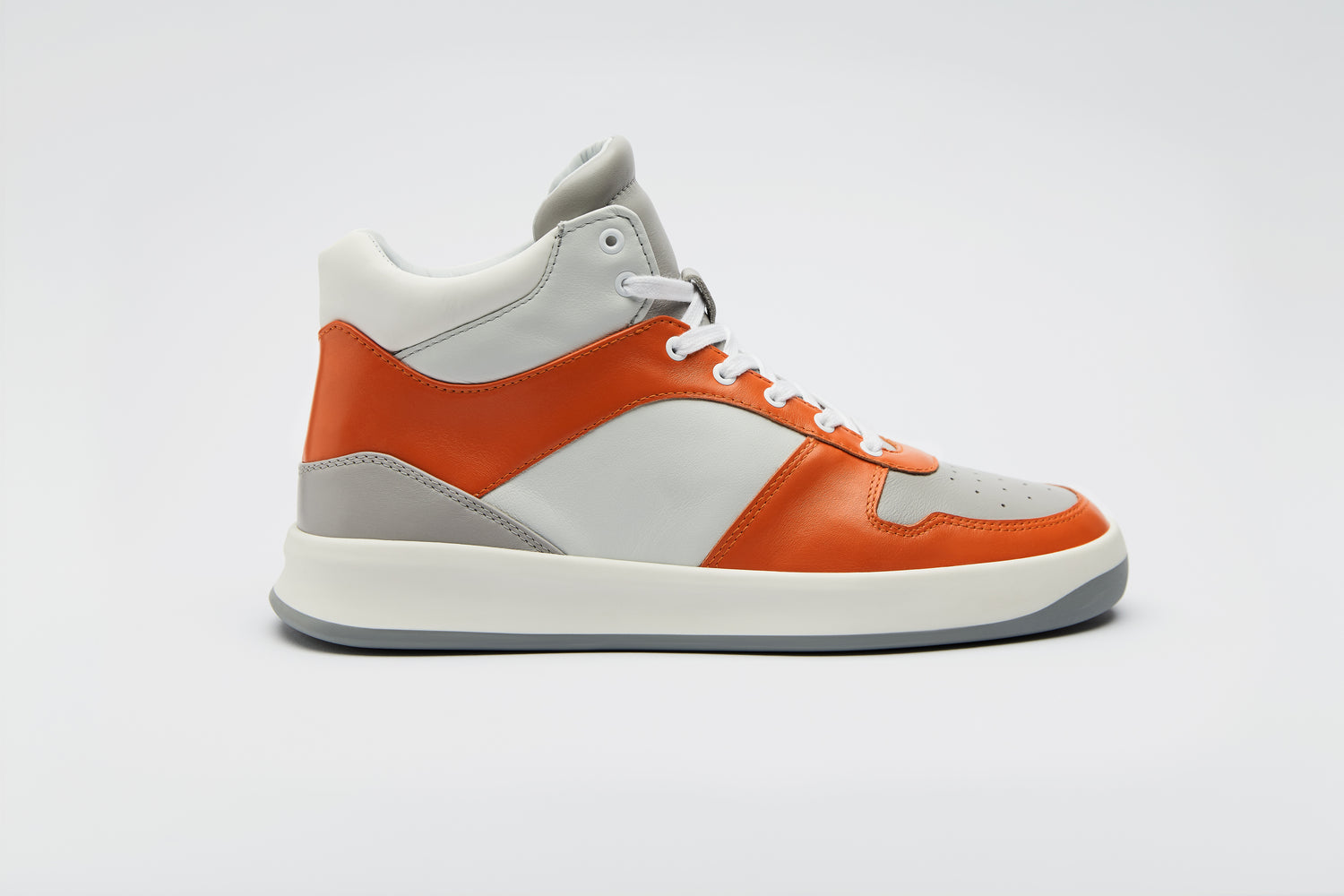 Vibrant Orange and white high-top sneaker, made with premium materials.