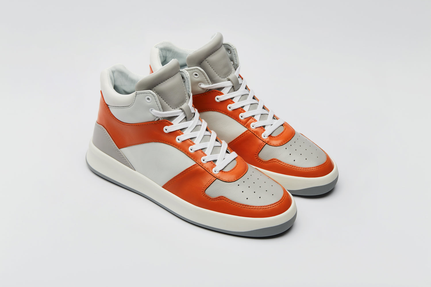 Bold colourful high-top sneaker with orange, grey and white premium leather panels.