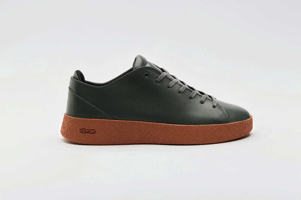 Premium dark grey leather on top a sienna Vibram crepe sole.